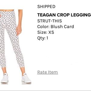 “Strut this” brand leggings. Pale pink with card print